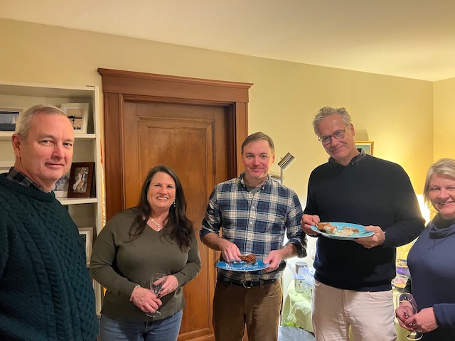 A group of people holding plates of food

Description automatically generated with medium confidence