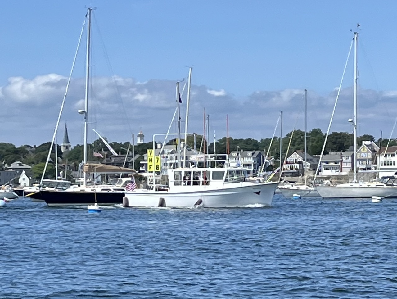 A group of boats in a harborDescription automatically generated