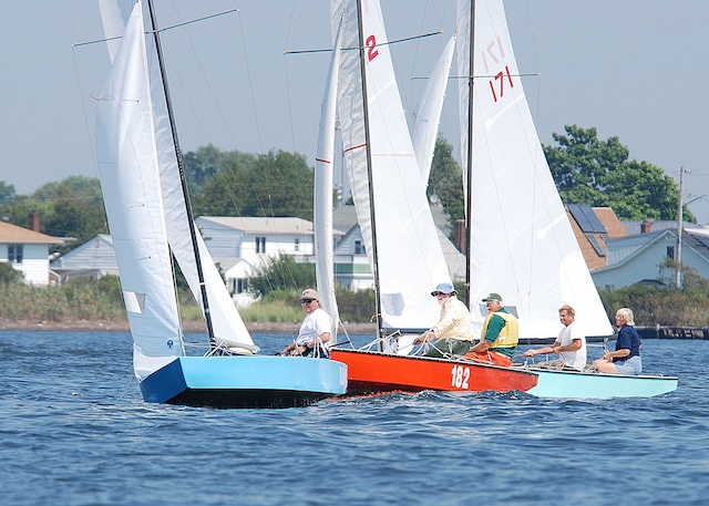 A group of people sailing on a lakeDescription automatically generated